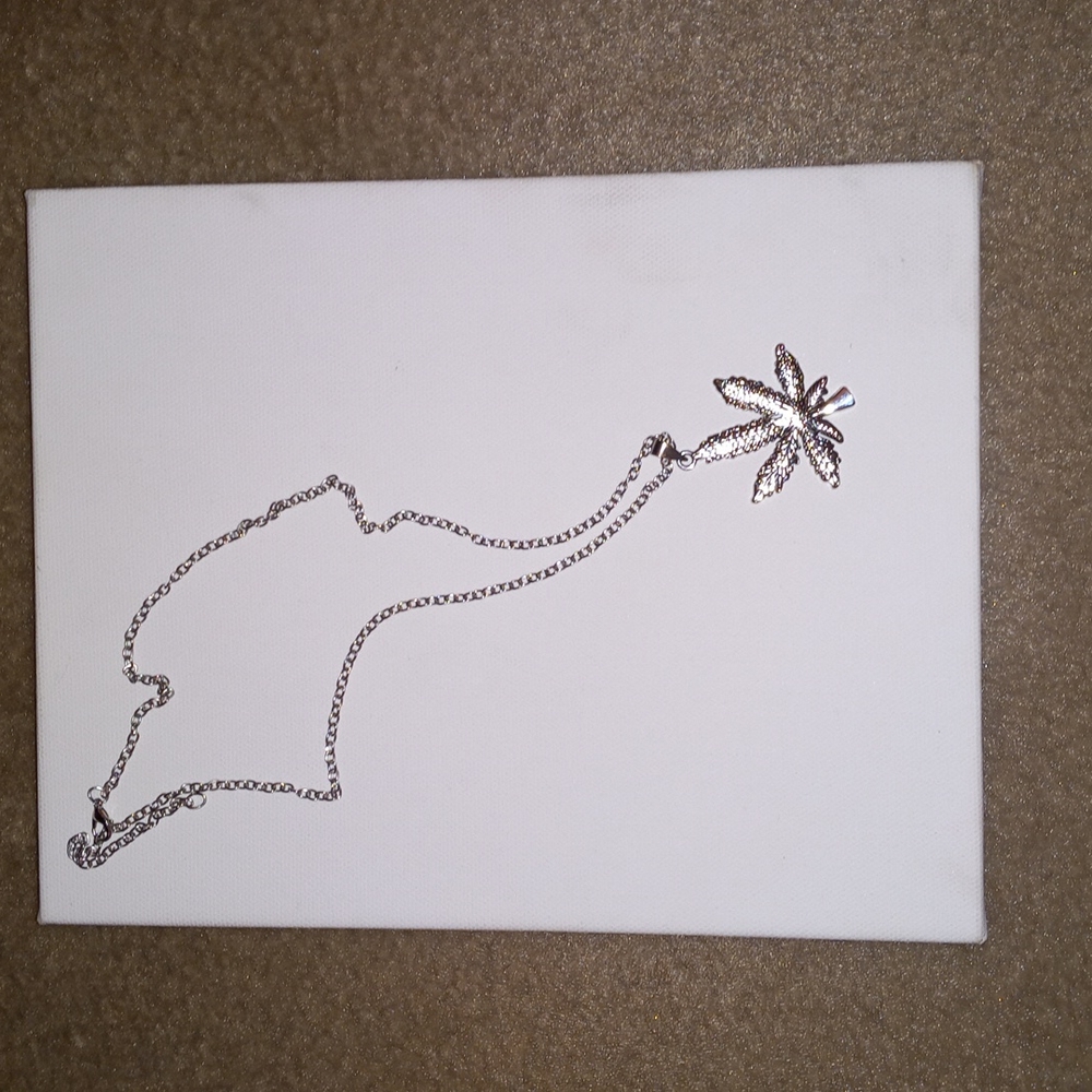 Brand new 24 in Long silver plant necklace